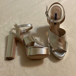 Stuart Weitzmann silver, strappy platforms size 9